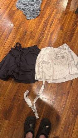 Used but no stains, selling as a pair size large satin Used but no stains, selling as a pair size large sand skirts skirts