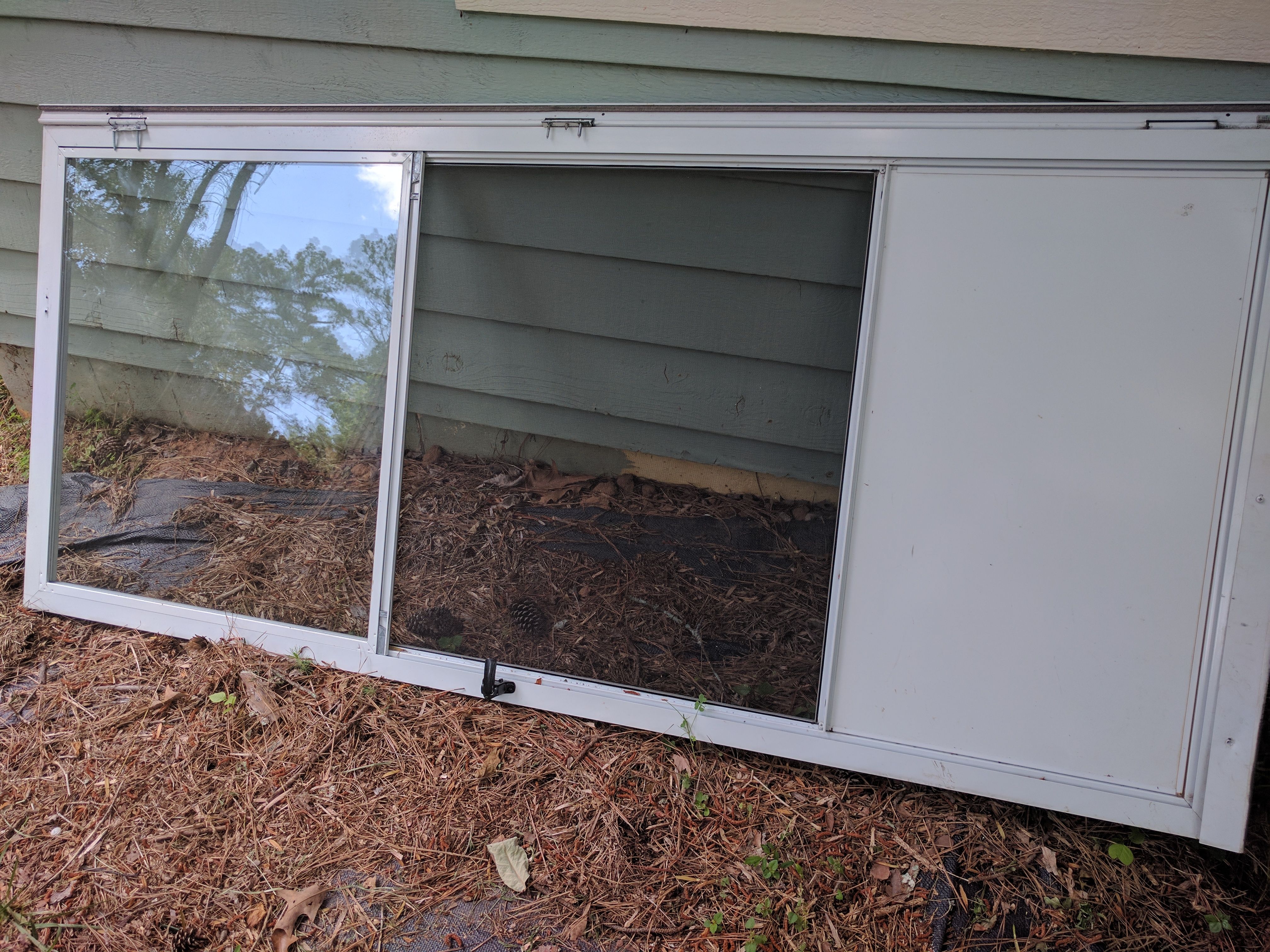 Storm door, half glass and half screen. Comes with hardware.