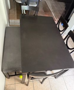 Table with 4 chairs and 1 bench