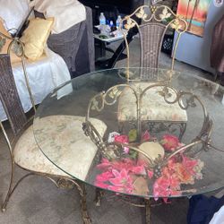 Antique Dinning Table With 4 Chairs And Floral Arrangements 