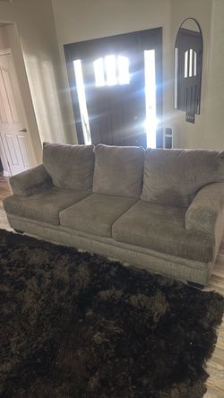 Slightly used couch with let out bed.