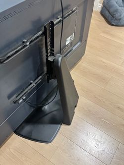 Sanus swivel TV  base (TV not included )