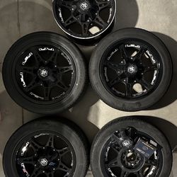Black alloy Wheels/Tire Set. 255/45 r18