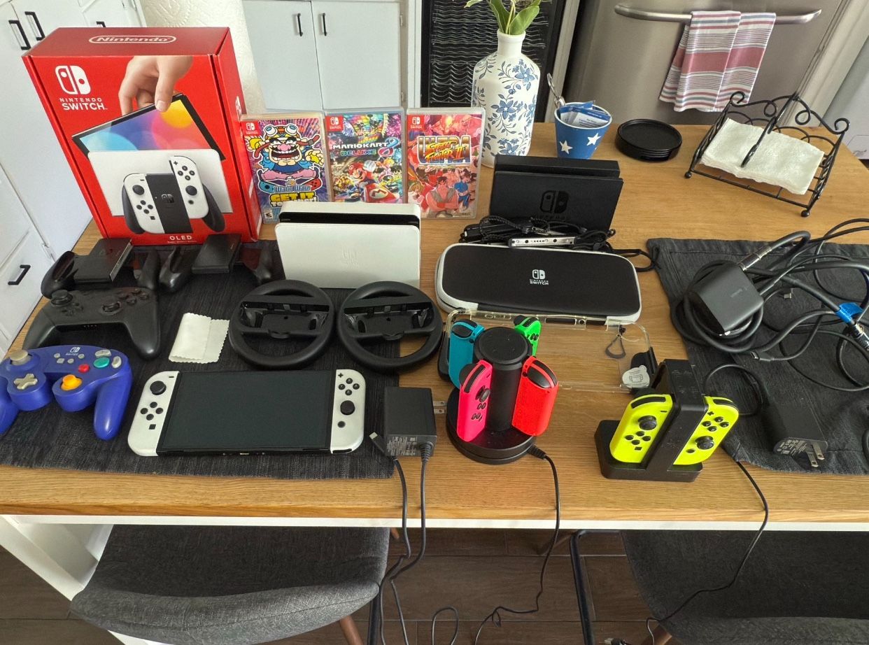 Working Perfectly Switch Oled With 2 Controllers And Games With All The Original Accessories
