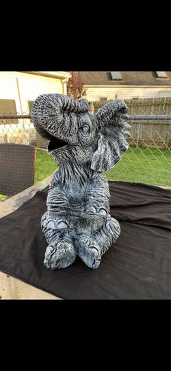 Large, happy elephant statue