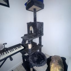 CAT TREE with TOYS and GROOMING SUPPLIES 
