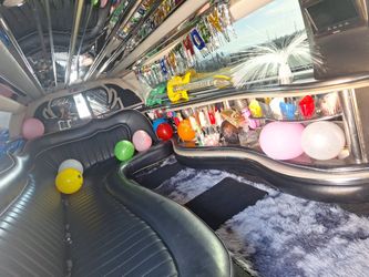 White 10 Passenger Limo $90 An Hr.