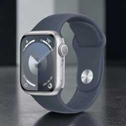 BRAND NEW Apple Watch Series 9 GPS (2024) 41mm Silver Aluminum Case with Storm Blue Sport Band - S/M