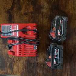 2 milwaukee batteries w charger 