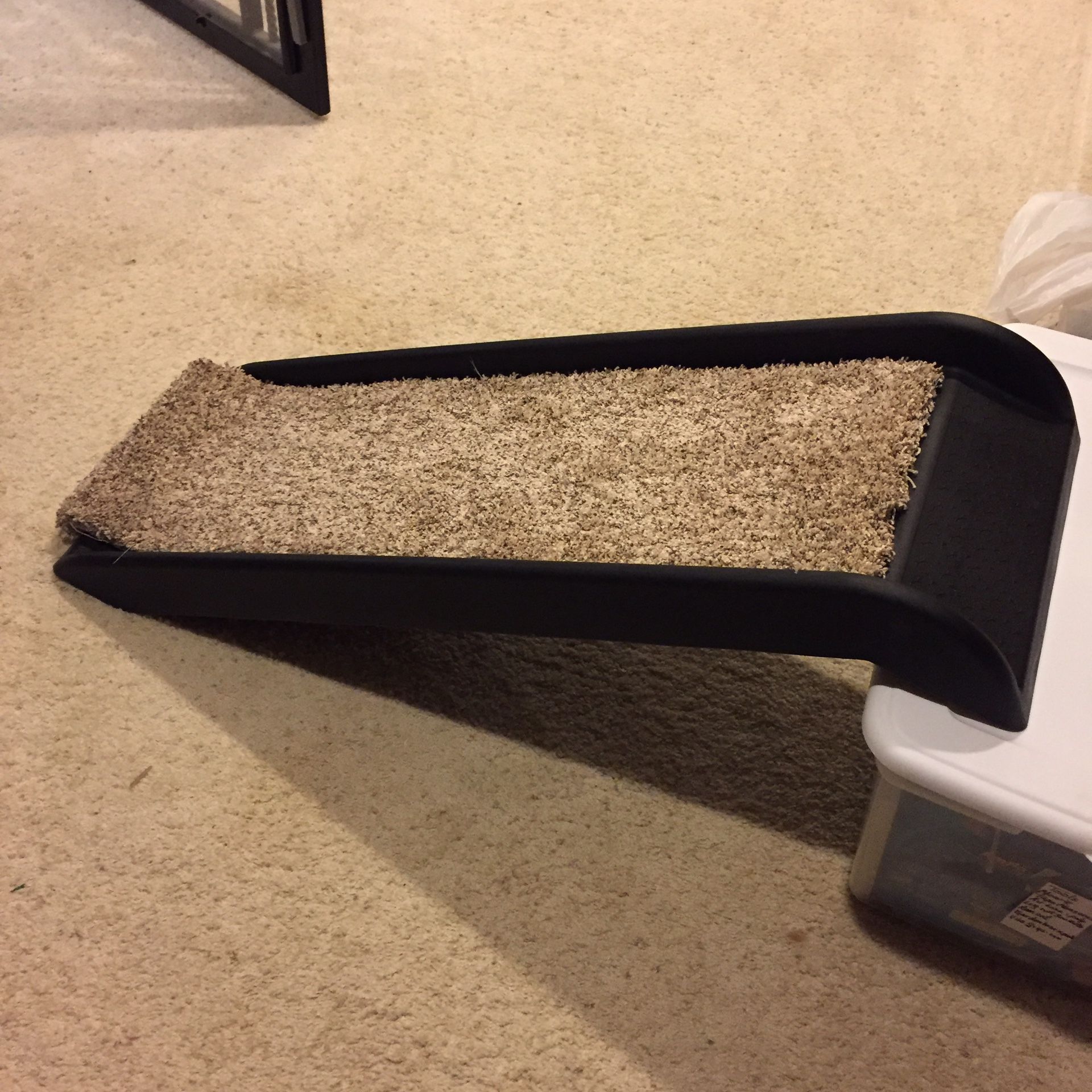 Pet Ramp for dogs. Works great for getting your dog onto the bed, couch or into the car. Very lightweight hard plastic. Easy