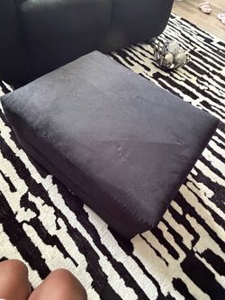 Black two piece living room set with ottoman