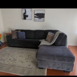 600 OBO )Ashely L Shaped Sofa. With Fire Place Tv Stand And Kitchen Table With Chairs  Used . 