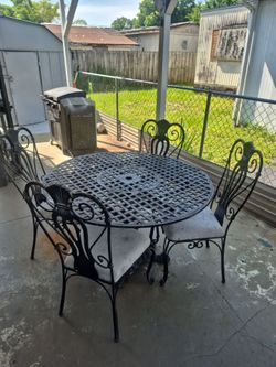 Out door Table and chairs  cast Iron 200 dollars  everything