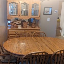 Oak Dining Table, Chairs, And Hutch 