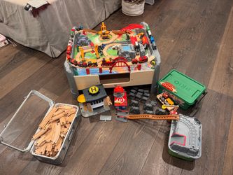 Brio and Hape tracks and trains, with Table and storage