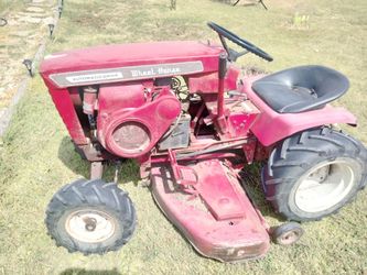 19 60s wheel horse riding mower