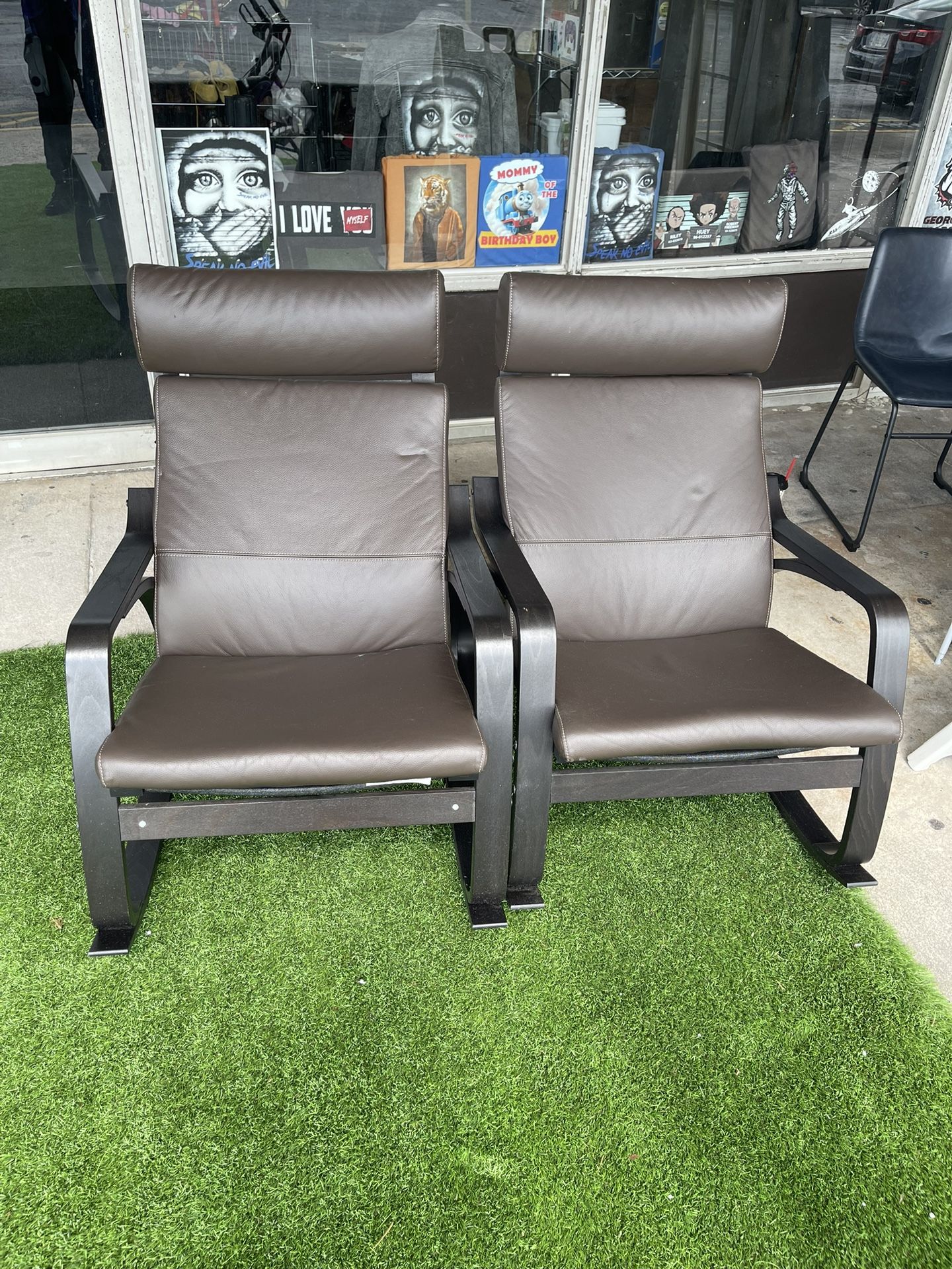 IKEA POÄNG armchairs, which feature a distinctive bentwood frame and a comfortable, cushioned seat and back