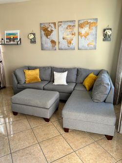 Beautiful Grey sectional couch with Ottoman