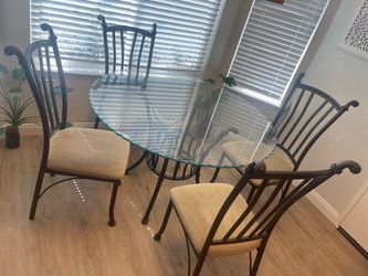 Round glass dining table with chairs