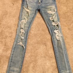 Blue ripped jeans with diamond studs