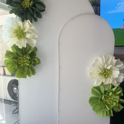 Handmade large crepe paper flowers.  Used for Photo Booth.  The arch back drop is not included.