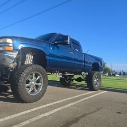 Lifted Blue Chevy Silverado Extended Cab Truck