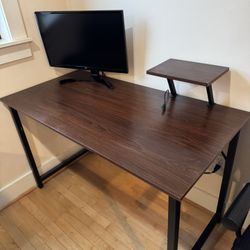 Wood and black metal desk with black desk chair