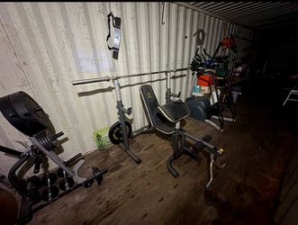 Weight Bench with Barbell and Plates