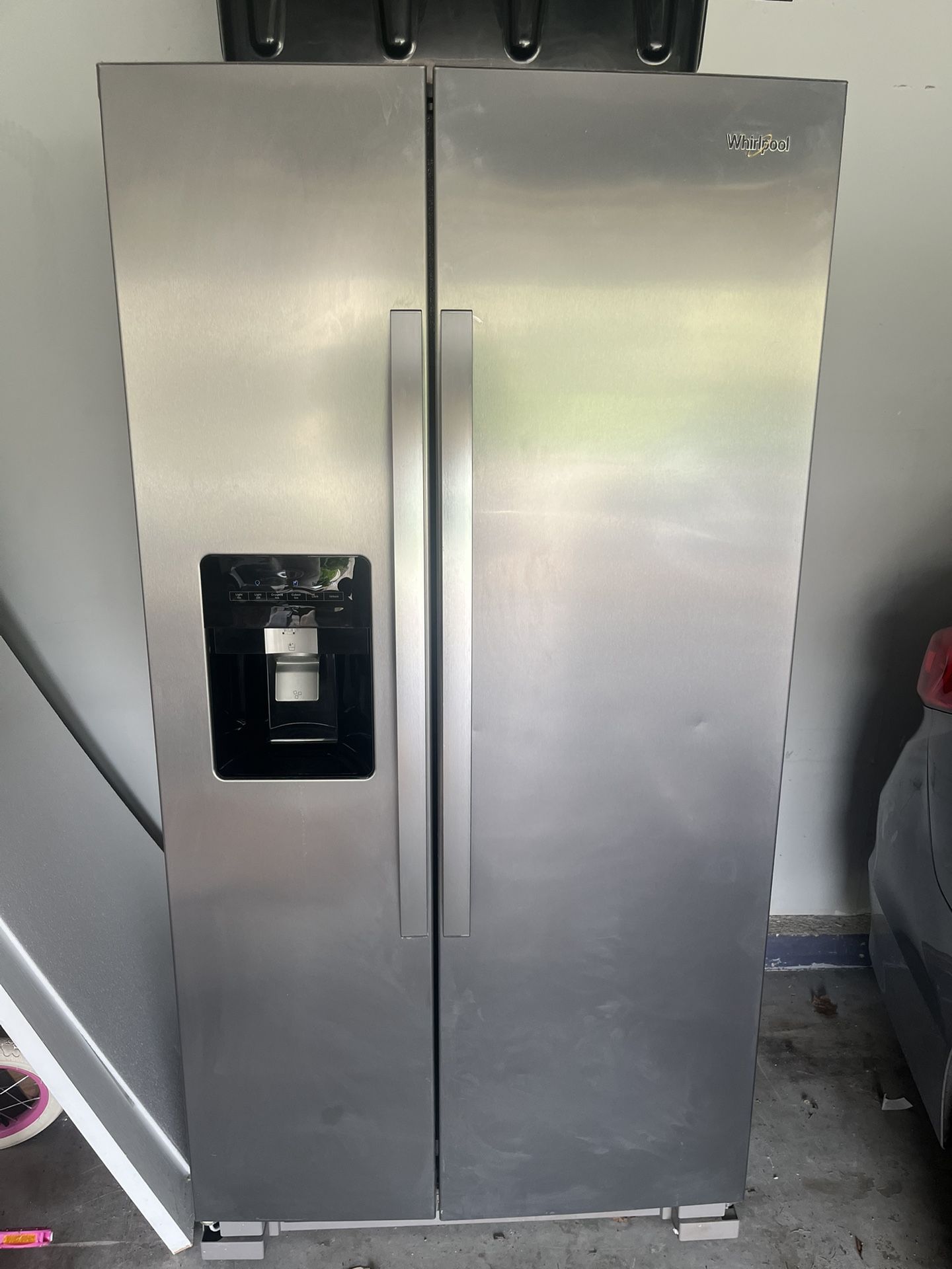 Monochromatic Stainless Steel Whirlpool 25 cu. Ft. Side By Side Refrigerator