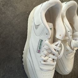 Sz 9.5  Reebok Women's Club C Extra shoes, which feature a platform midsole with a geometric design