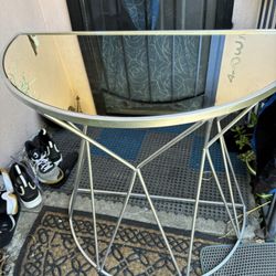 mirrored side table.Hemispere form, base silver color metal. 