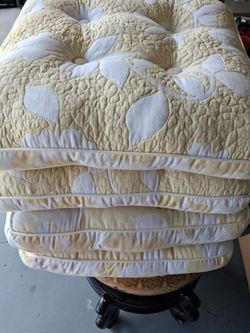 4 chair cushions. Light Yellow. Used once and ids about 4" thick