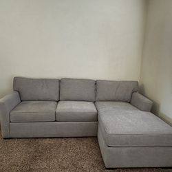 Grey Reversible Chaise Couch With Sleeper Sofa