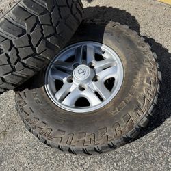 4 lx470 wheels with 285/75/16 mt tires 50%-70 tread