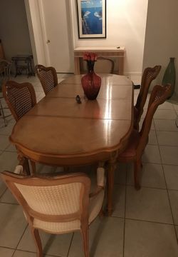 Antique wooden dining table and chairs.