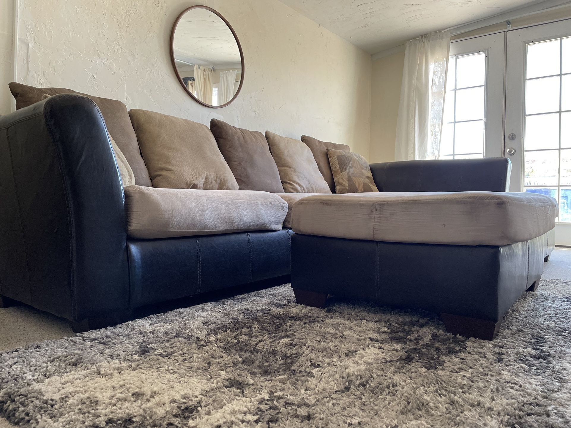 Ashley Logan Stone 2 PC Sectional And Ottoman