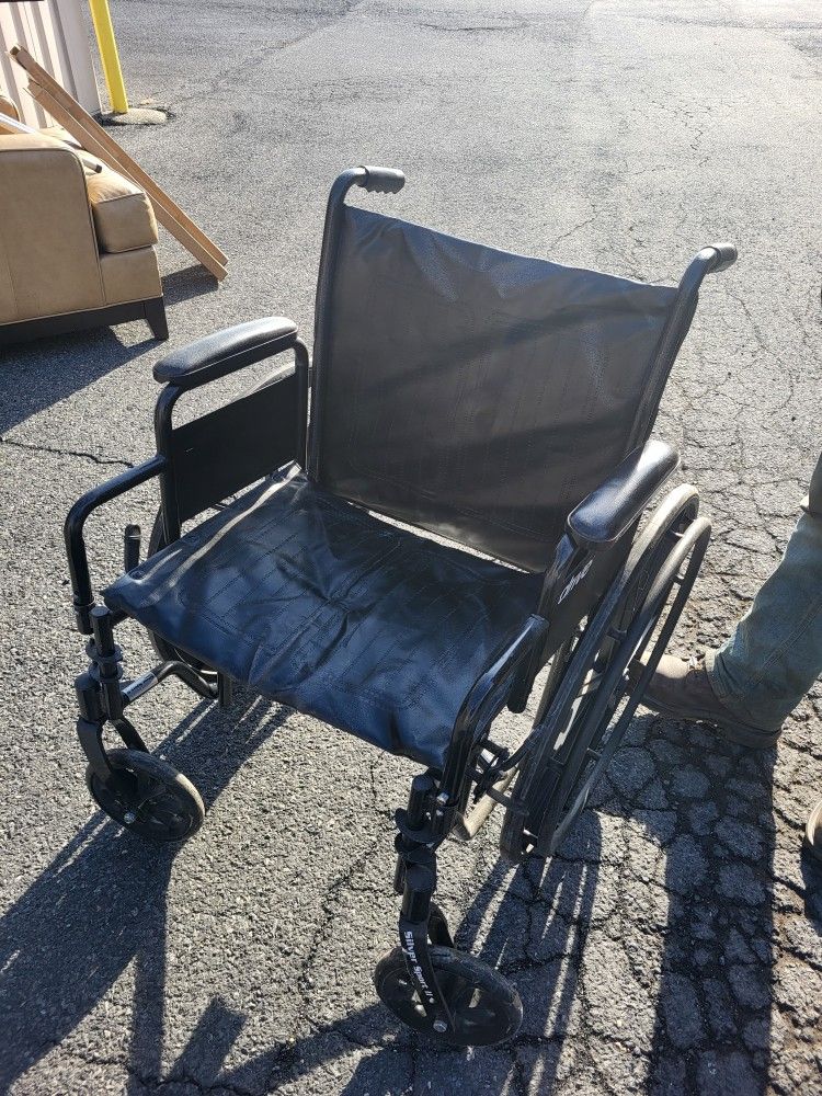 Wheelchair With Leg Rests.
