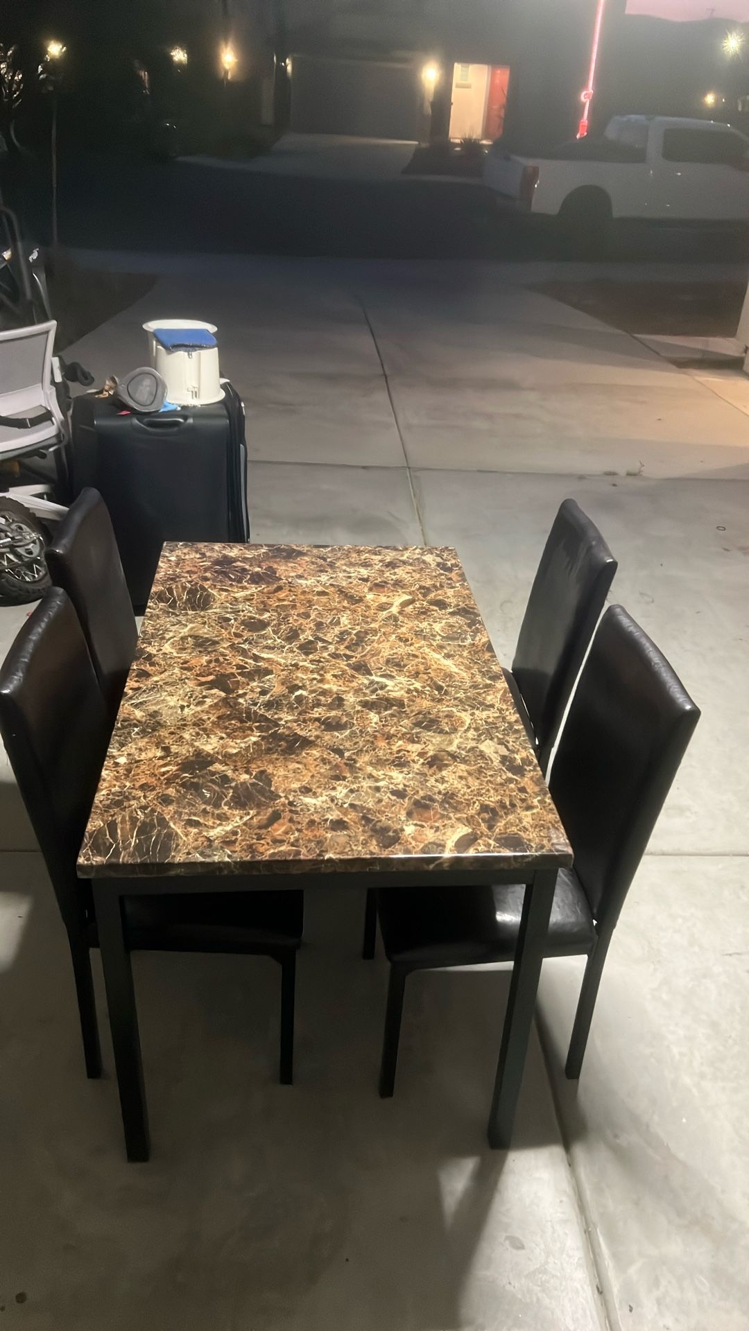 I have two of the same tables selling them each for $50 both in great shape and come with four chairs each