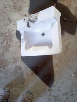 One standard bathroom sink with faucet