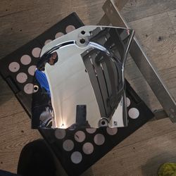 chrome transmission sprocket cover for a Harley-Davidson Sportster. 