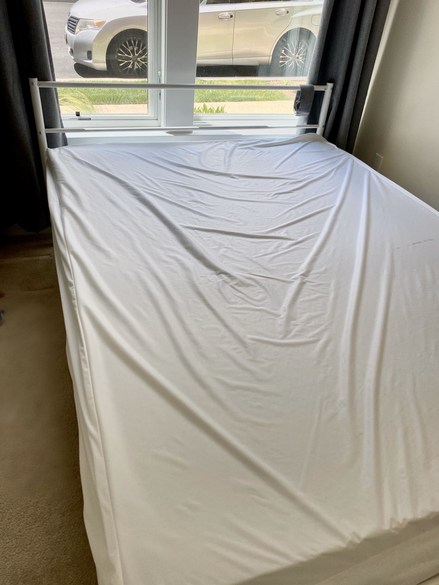 Full bed and mattress with mattress protector.