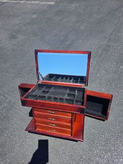 Gorgeous antique style jewelry storage. No flaws or damage has a functional skeleton key that locks and unlocks both swinging side doors. Truly amazin