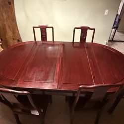 Solid wood dining table with two leafs (can convert to a circle table)