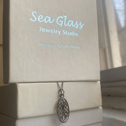 Southern Gates Oval Flower Scroll Pendant