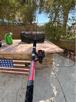 Black/red medium-heavy 7’0 Ugly stick fishing rod