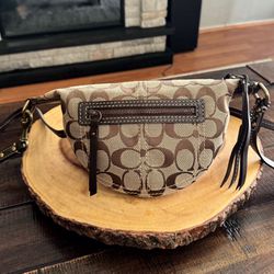 Coach J0671 Signature C Mini Swing Pack Cross Body Bag in brown & khaki. Like new! Excellent condition.