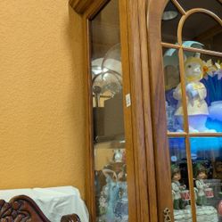 Wood curio cabinet.