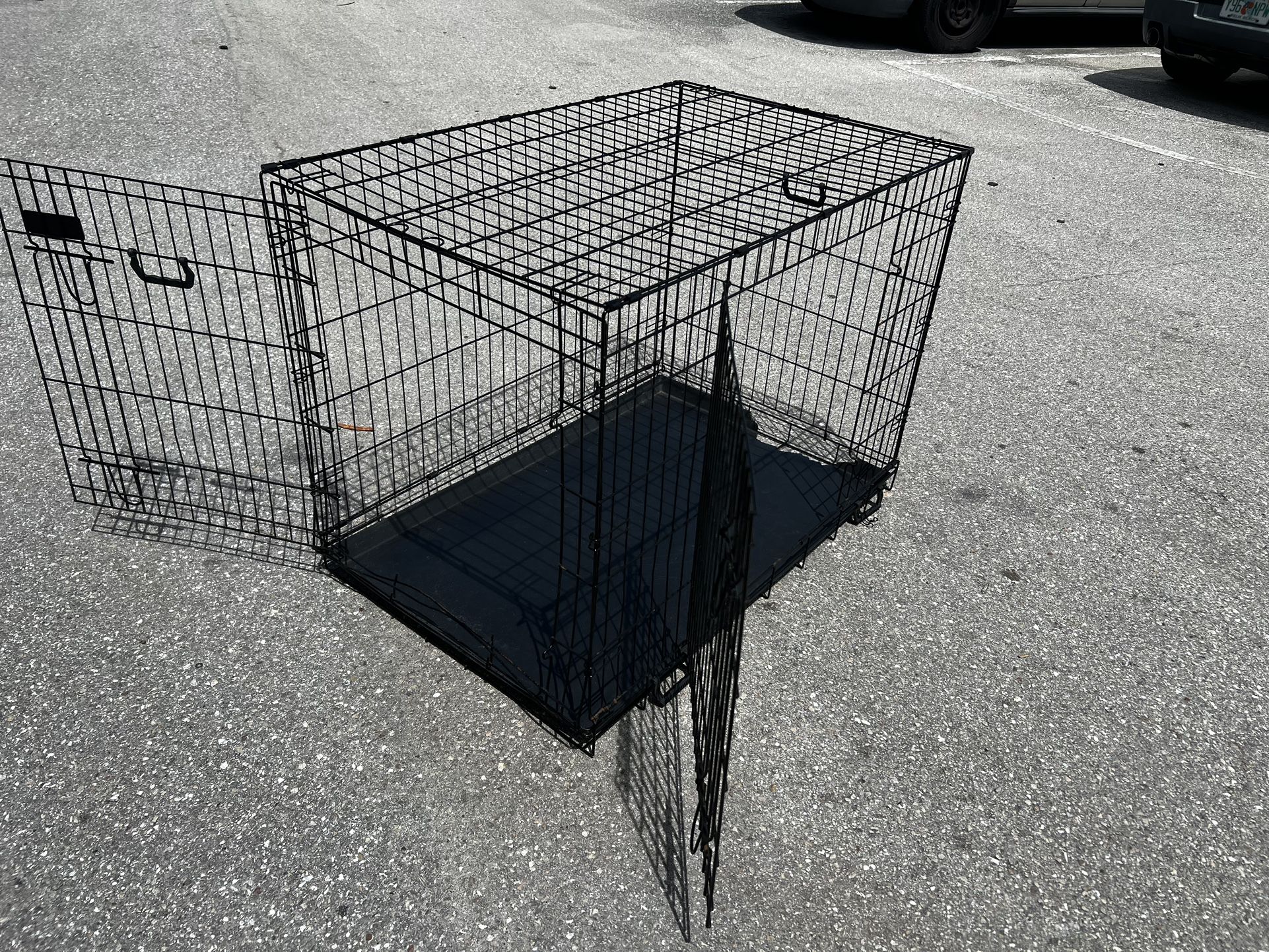 42x28x28in Extra Large Black Metal Double Door Dog Pet Animal Cage Containment Crate! Tray has a piece cracked off. Great for dogs 71-90lbs!
