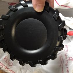 Tire shaped water bottle with red straw