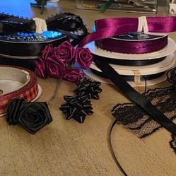 Black And Garnet Satin Ribbon Spools, Lace Strips, And Silk Flower Rosettes